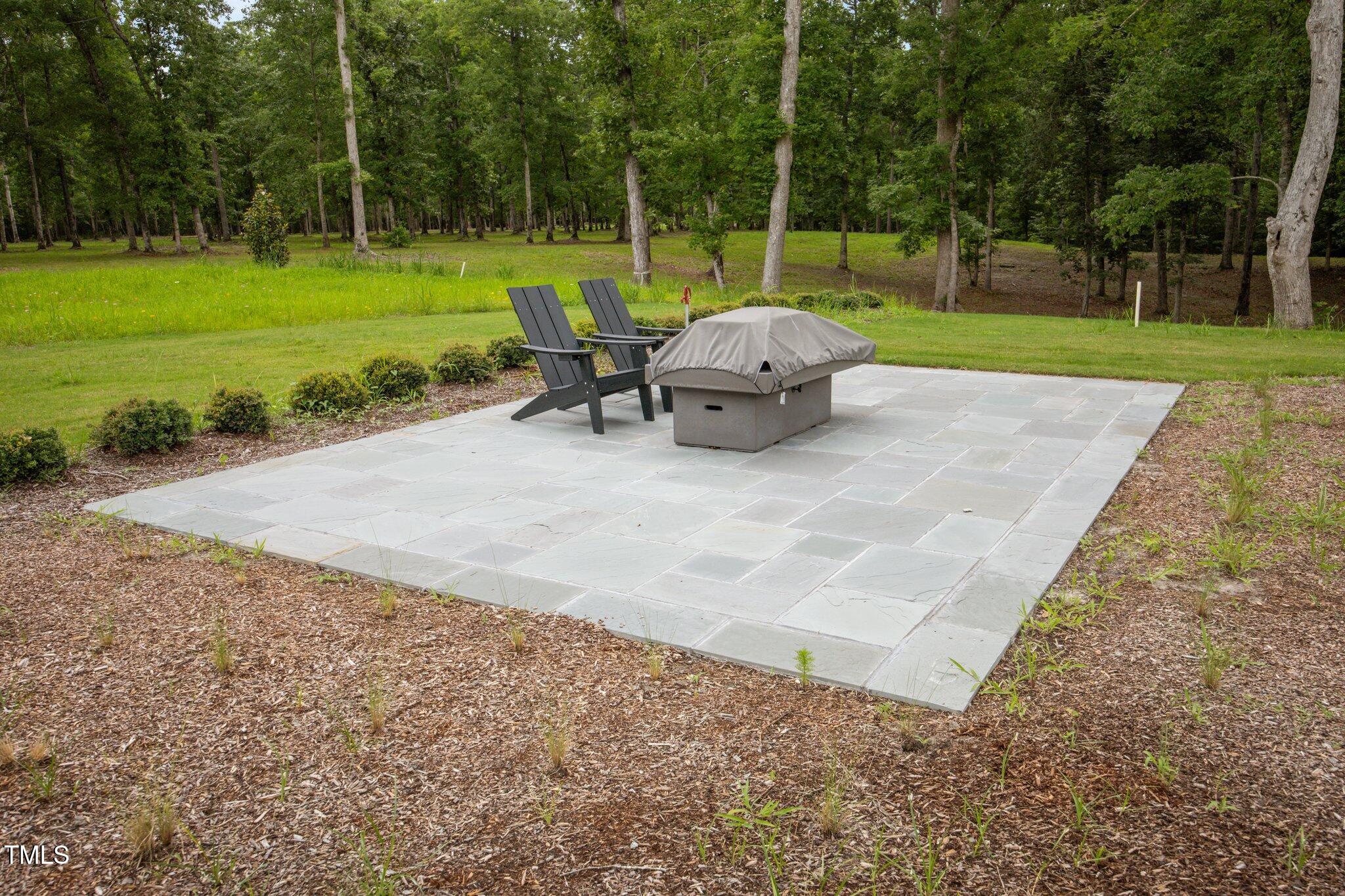 4725 Creeks Junction Road Blounts Creek, NC 27814 - Photo 37 of 42 a backyard of a house with yard and trampoline