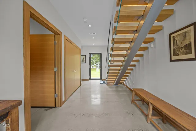 a view of an entryway with wooden floor