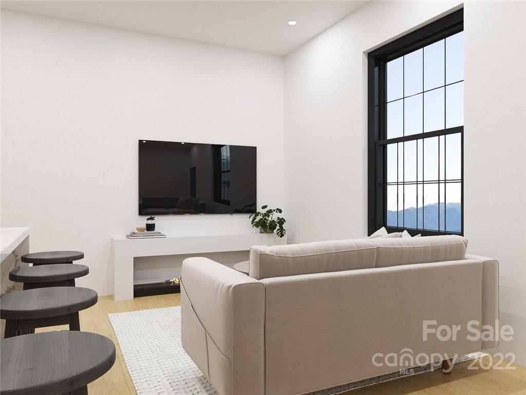 201 Grandin Road, Unit 7 Charlotte, NC 28208 - Photo 2 of 12 a living room with furniture and a flat screen tv