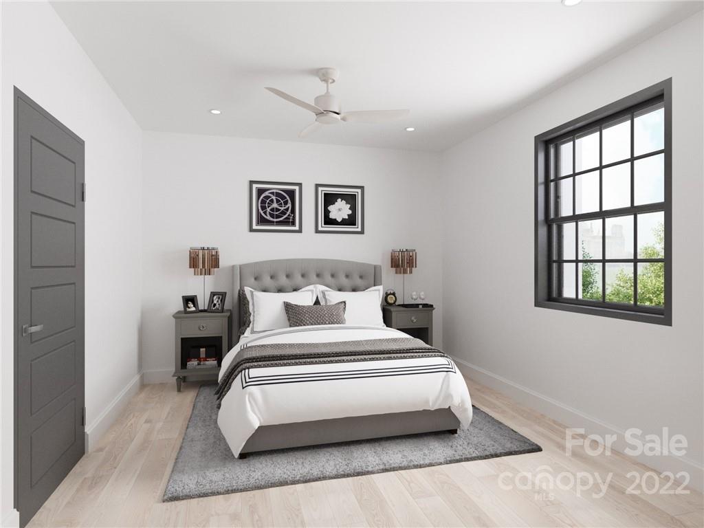 201 Grandin Road, Unit 7 Charlotte, NC 28208 - Photo 5 of 12 a bedroom with a large bed and a window