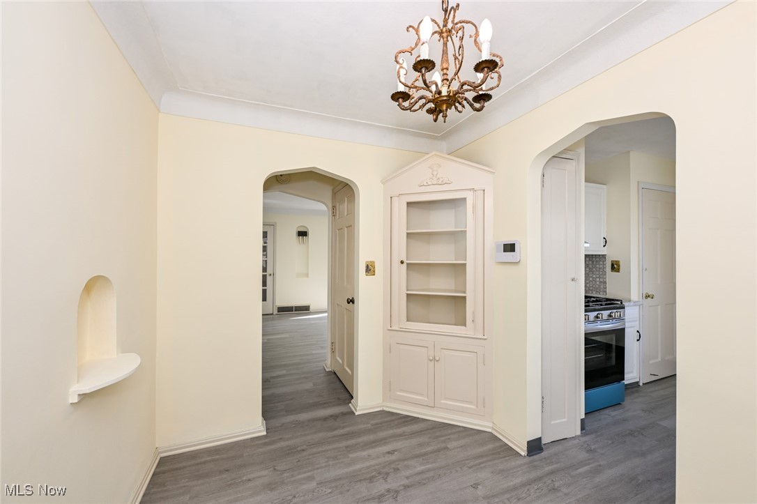 4033 Wyncote Road South Euclid, OH 44121 - Photo 7 of 25 Corridor with hardwood / wood-style flooring and a chandelier