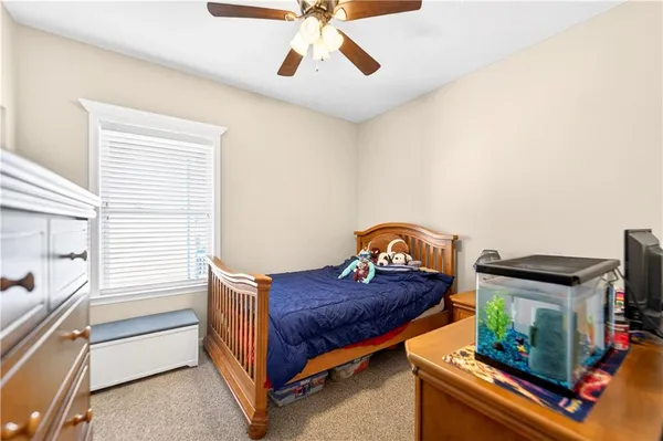 a bedroom with furniture and a window