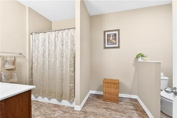 a view of room with window and bathroom
