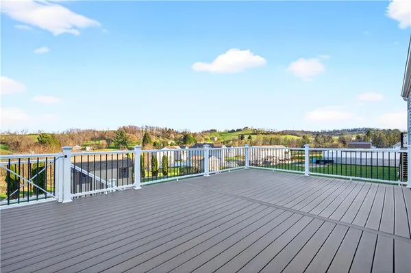a view of a balcony with wooden floor