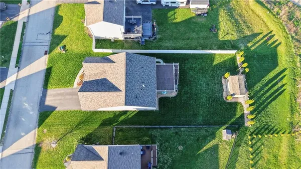 a aerial view of multiple houses with yard