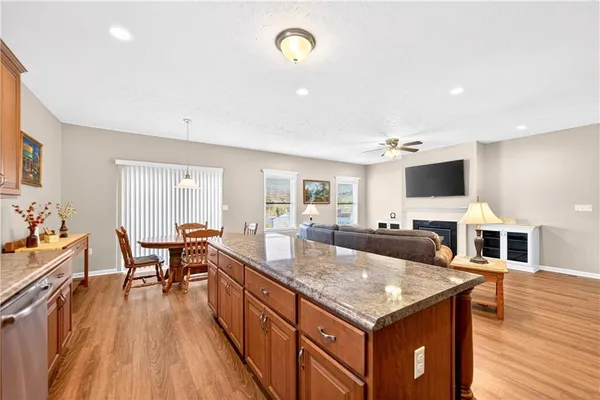 a kitchen with counter space and living room