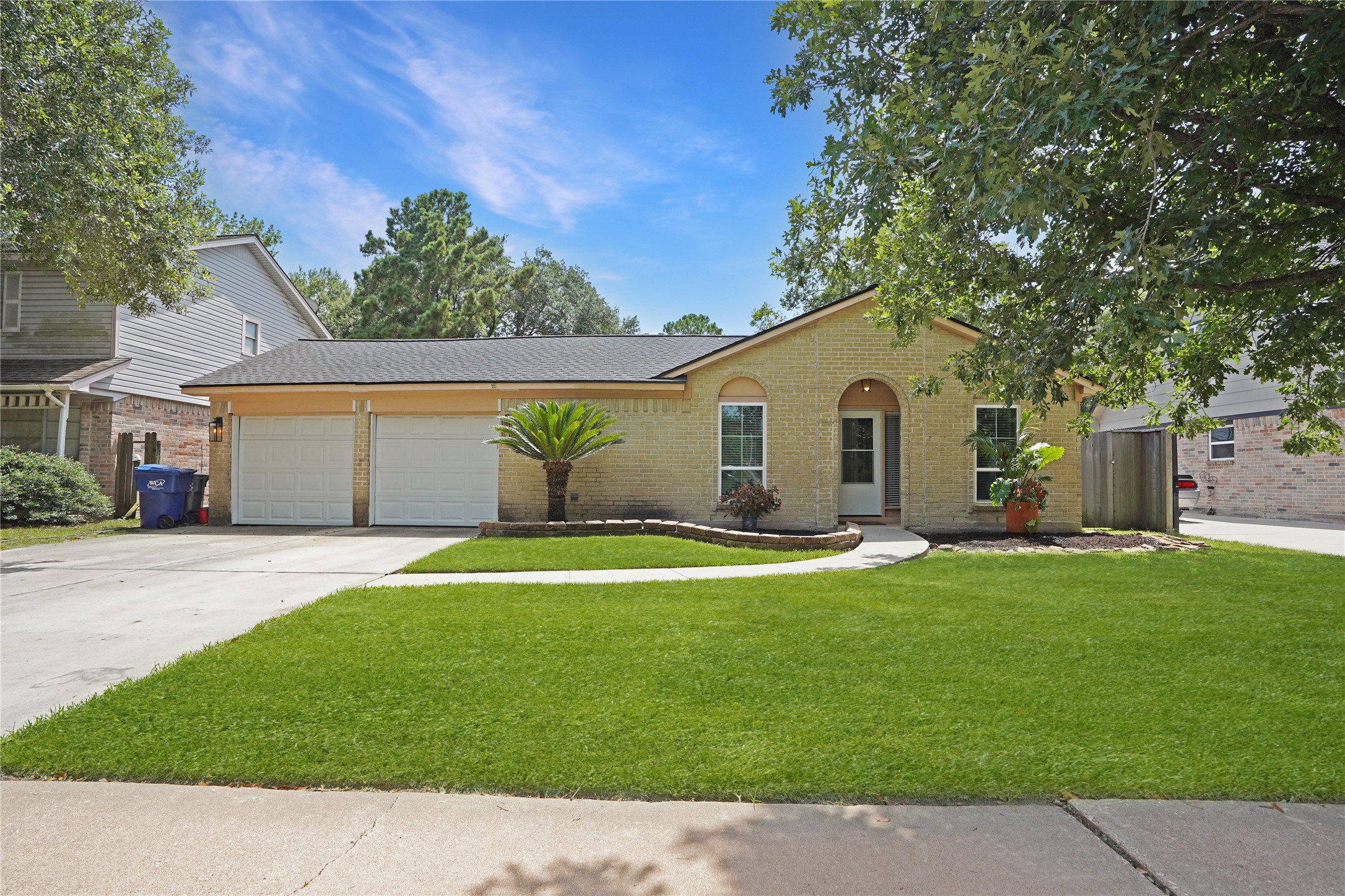 17119 Mellow Ridge Drive Spring, TX 77379 - Photo 31 of 32 This charming single-story home features a brick exterior, a neatly manicured lawn, and a curved walkway leading to the front entrance. It includes a two-car garage and is surrounded by mature trees, offering both curb appeal and shade.