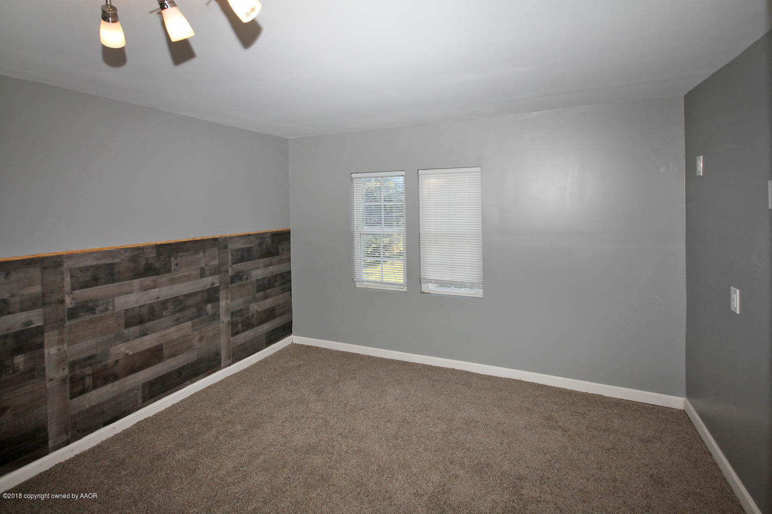 4214 South Travis Street Amarillo, TX 79110 - Photo 8 of 17 an empty room with windows