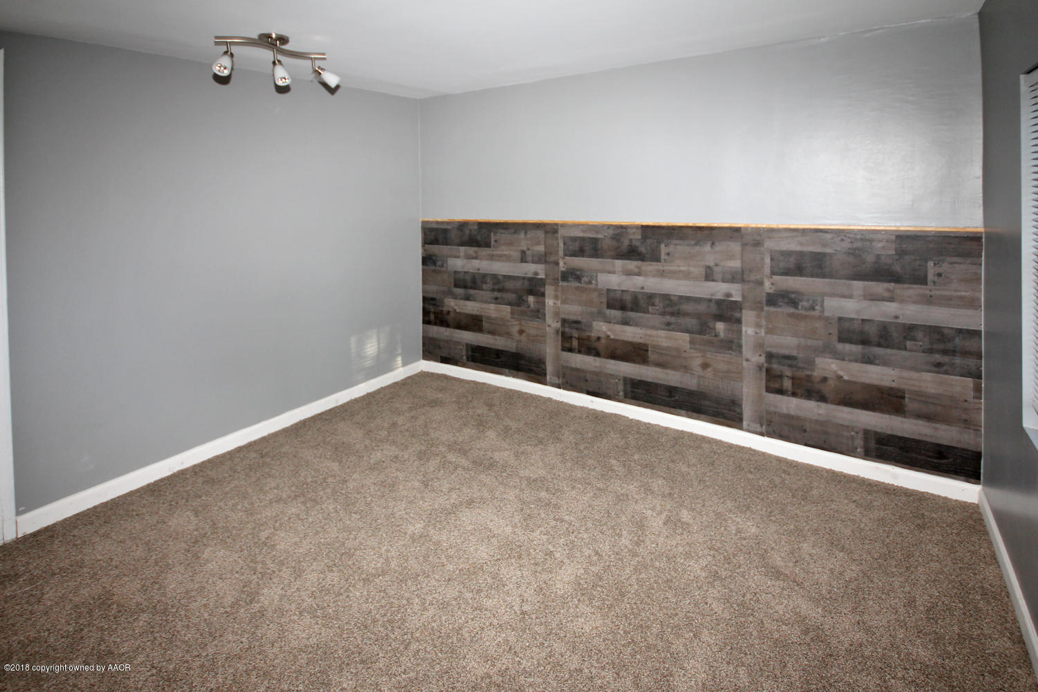 4214 South Travis Street Amarillo, TX 79110 - Photo 9 of 17 a view of an empty room with a fireplace