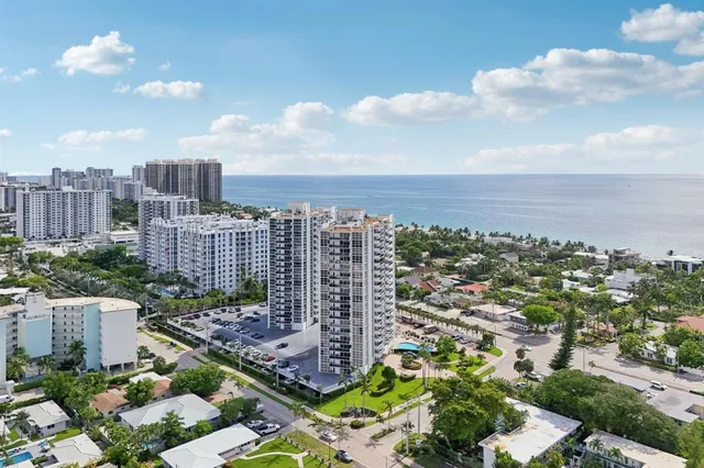 a front view of a building with a garden