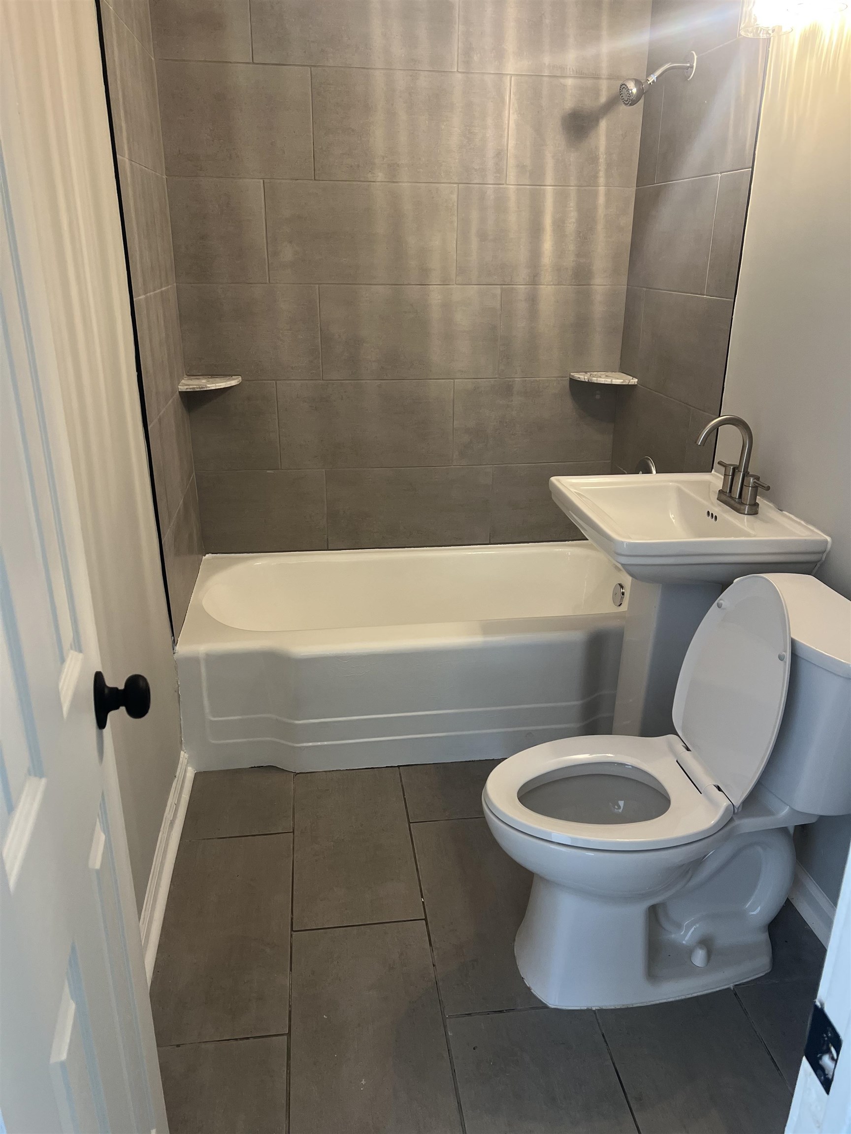 7871 Sherman Road Millington, TN 38053 - Photo 8 of 20 Bathroom featuring bathing tub / shower combination, tile patterned flooring, toilet, and baseboards