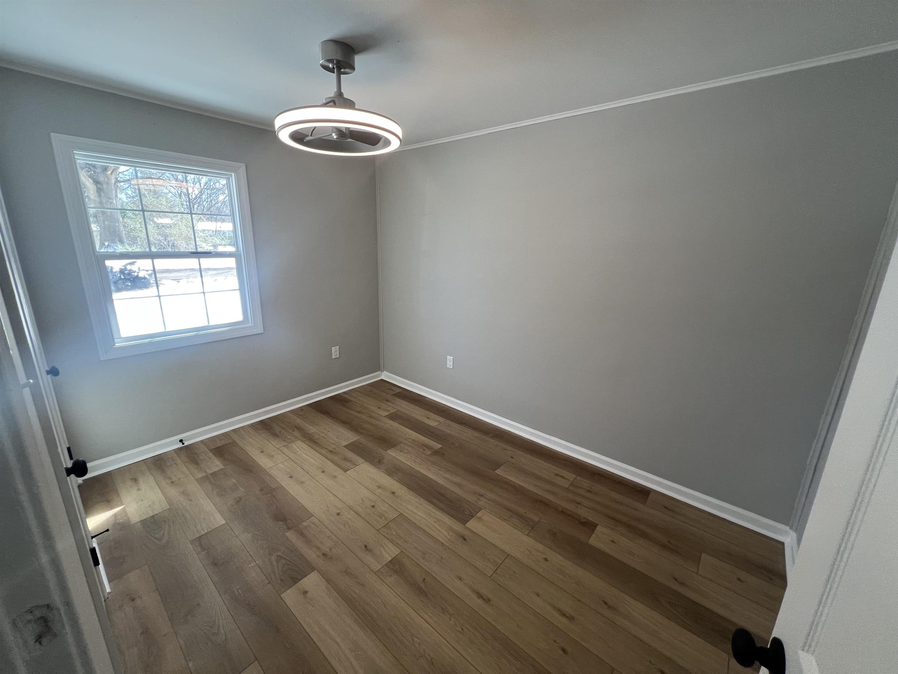 7871 Sherman Road Millington, TN 38053 - Photo 10 of 20 Unfurnished room featuring wood finished floors and baseboards