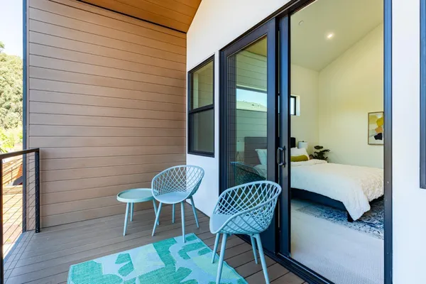 a view of a chairs and table in patio