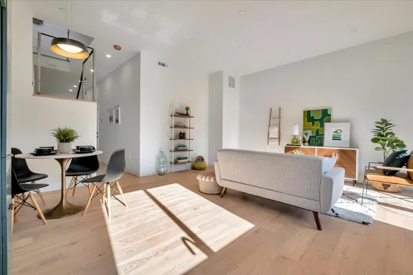 a living room with furniture and a table