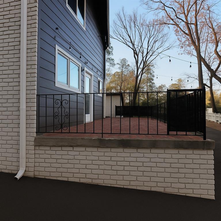 1277 Goodwin Road Northeast, Unit 1271 Atlanta, GA 30324 - Photo 16 of 19 a view of a brick house with a large window