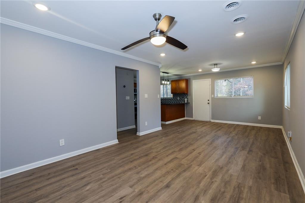 1277 Goodwin Road Northeast, Unit 1271 Atlanta, GA 30324 - Photo 5 of 19 wooden floor in an empty room with a window