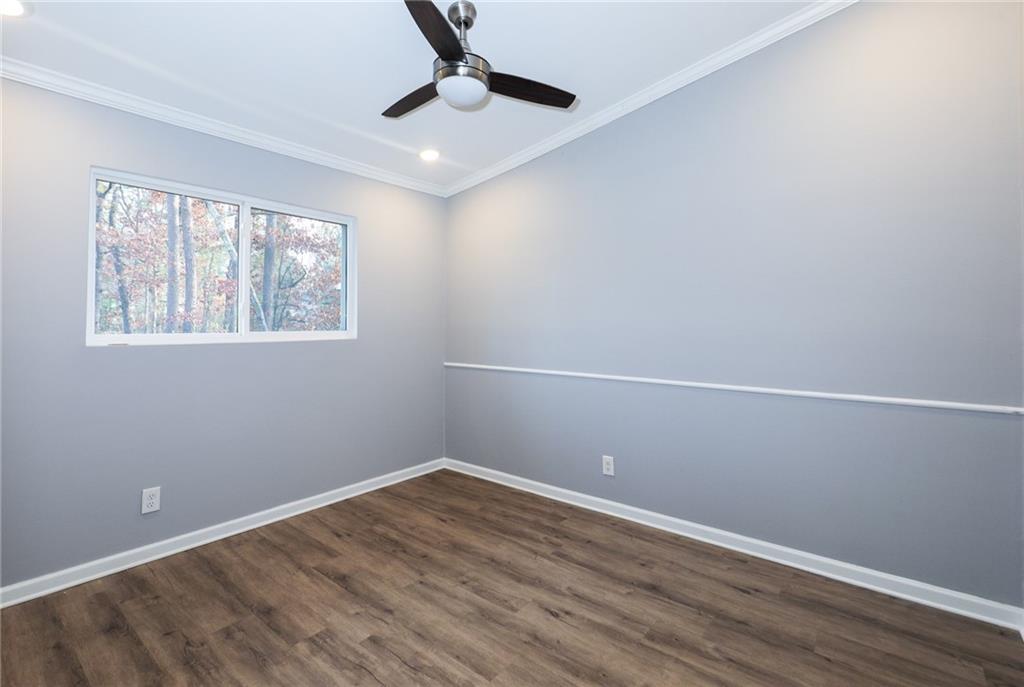 1277 Goodwin Road Northeast, Unit 1271 Atlanta, GA 30324 - Photo 10 of 19 wooden floor in an empty room with a window