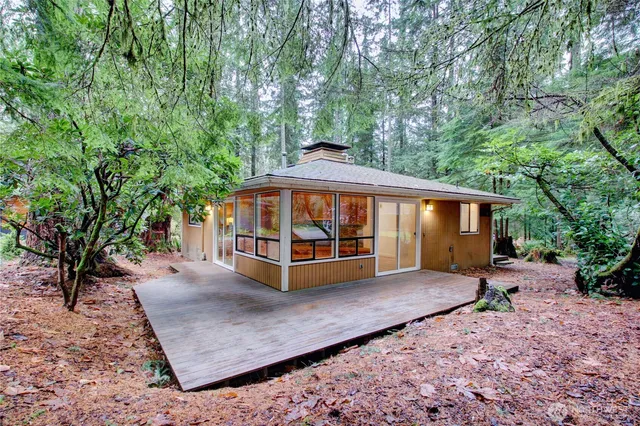 a view of a house with a yard patio and deck