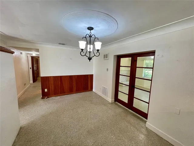 a view of a livingroom with a ceiling fan and window