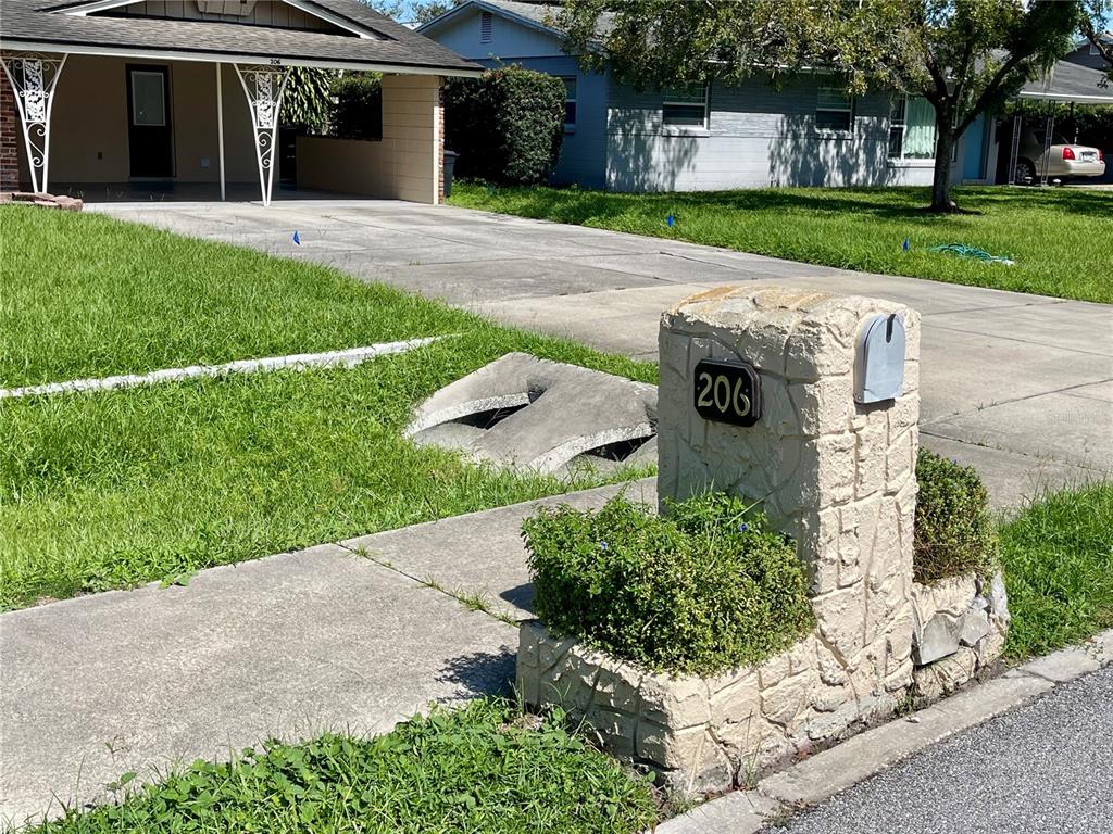 206 Robin Road Altamonte Springs, FL 32701 - Photo 2 of 36 a view of a house with a yard and a garden