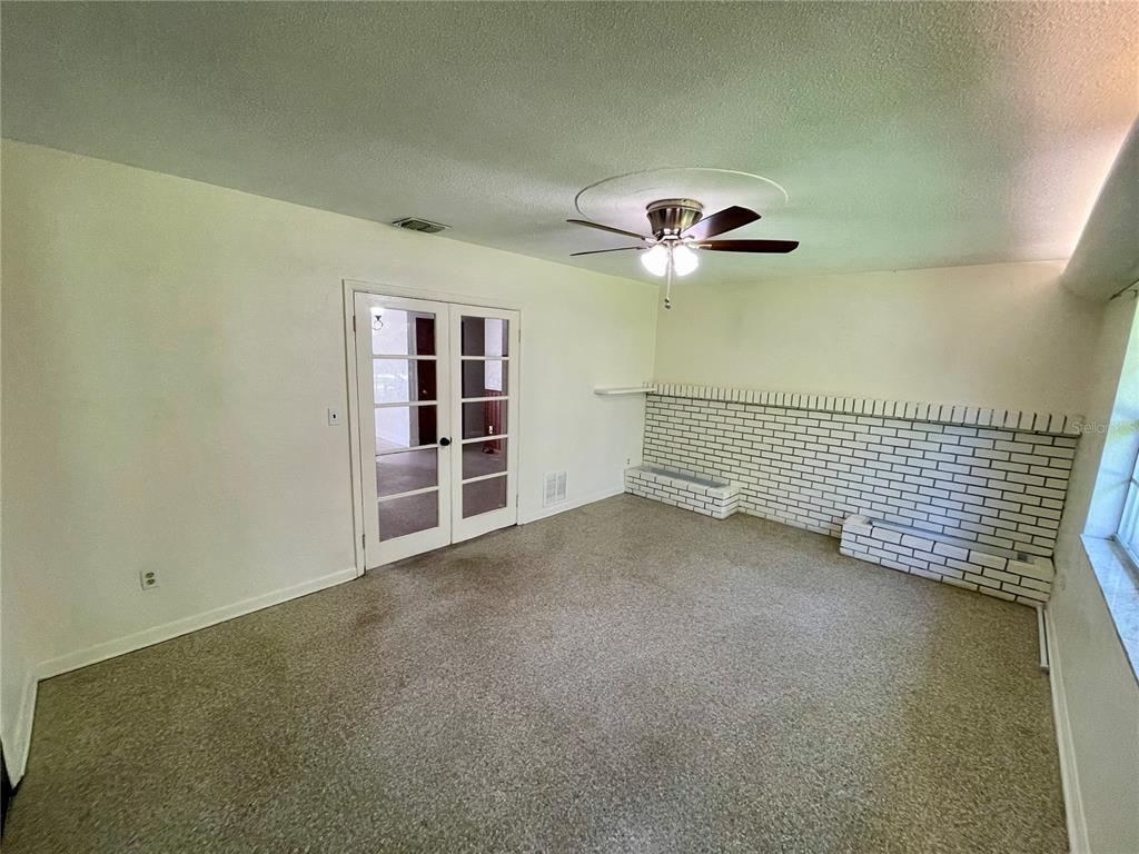 206 Robin Road Altamonte Springs, FL 32701 - Photo 22 of 36 a view of a livingroom with a ceiling fan and window