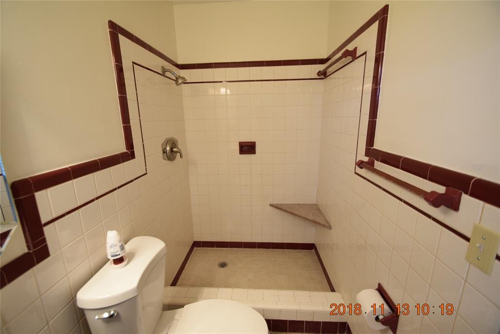 206 Robin Road Altamonte Springs, FL 32701 - Photo 30 of 36 a bathroom with a toilet and a shower curtain