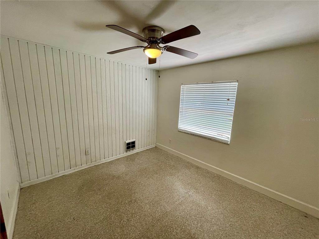 206 Robin Road Altamonte Springs, FL 32701 - Photo 32 of 36 an empty room with windows and fan
