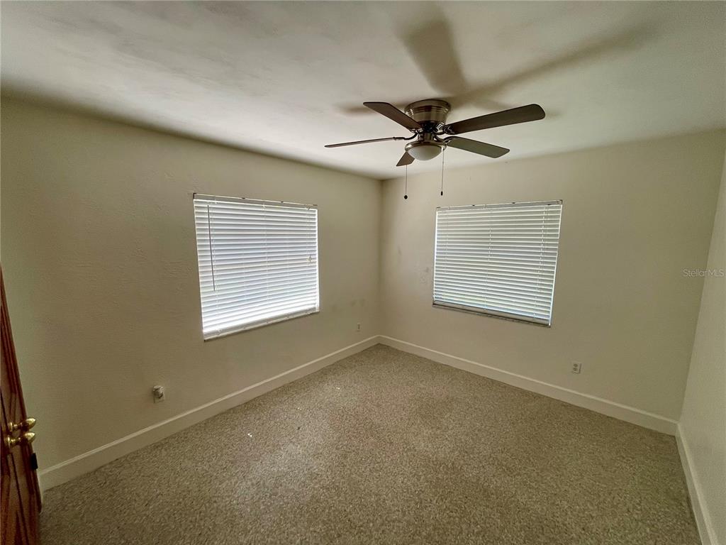 206 Robin Road Altamonte Springs, FL 32701 - Photo 34 of 36 an empty room with a window and a fan