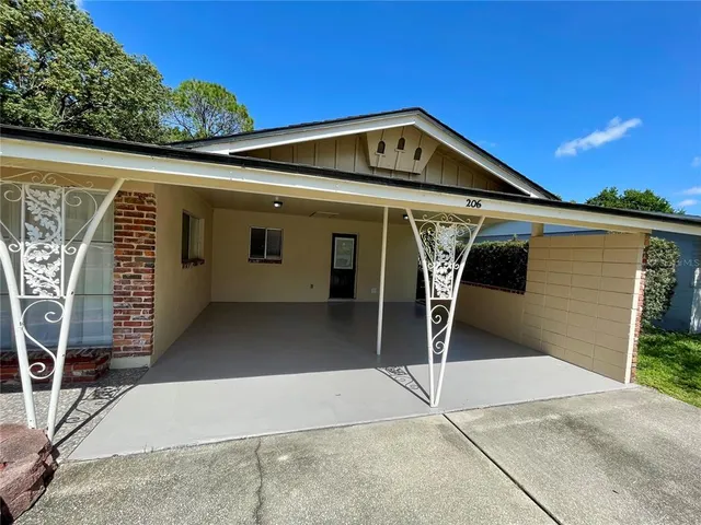 a front view of a house with garage