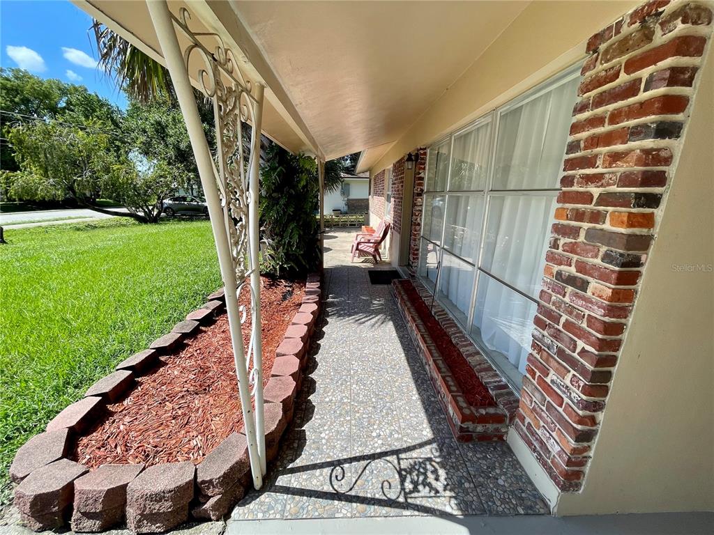 206 Robin Road Altamonte Springs, FL 32701 - Photo 7 of 36 a view of a pathway of a house with a yard