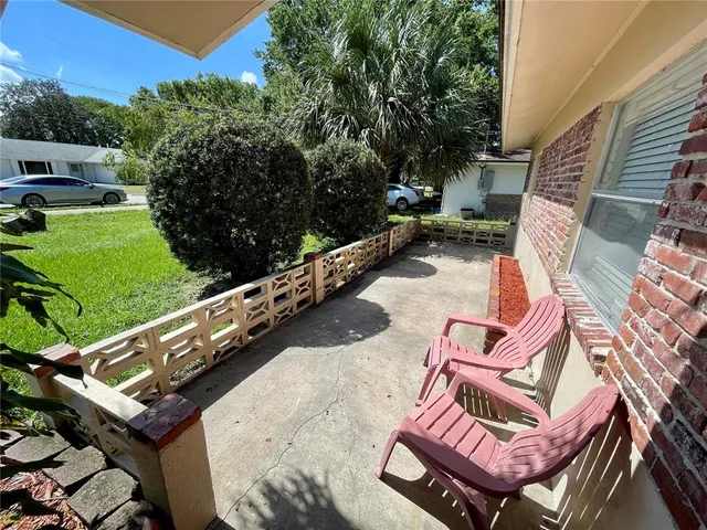 a view of a chairs and tables in the backyard