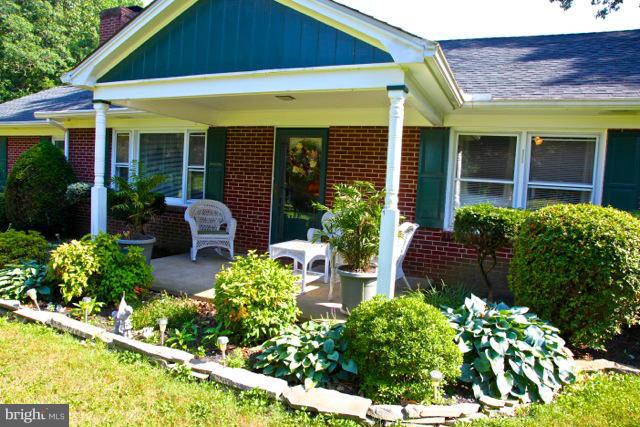 2122 Fallston Road Fallston, MD 21047 - Photo 2 of 30 a front view of a house with a garden