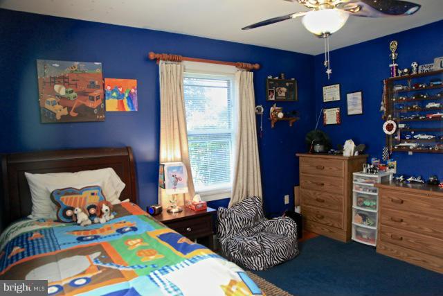 2122 Fallston Road Fallston, MD 21047 - Photo 18 of 30 a bedroom with a bed and wooden floor