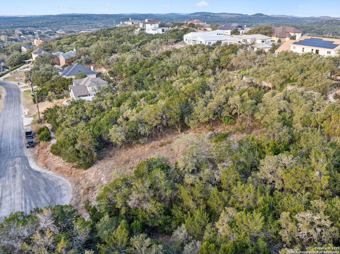 25625 Mt Rhapsody San Antonio, TX 78260 - Photo 10 of 20 an aerial view of residential houses with outdoor space and trees