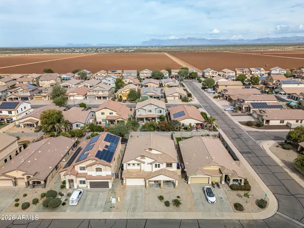 an aerial view of residential houses with outdoor space