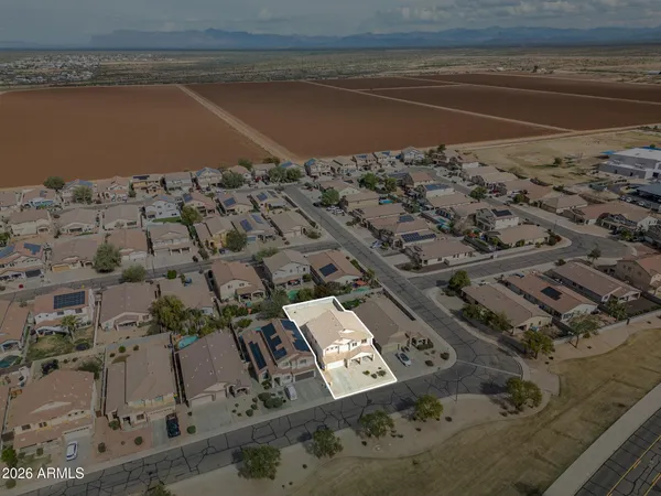 an aerial view of residential houses with outdoor space