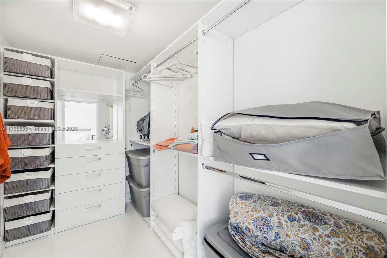 18201 Collins Avenue, Unit PH5109 Sunny Isles Beach, FL 33160 - Photo 26 of 53 a view of walk in closet with clothes and shoes