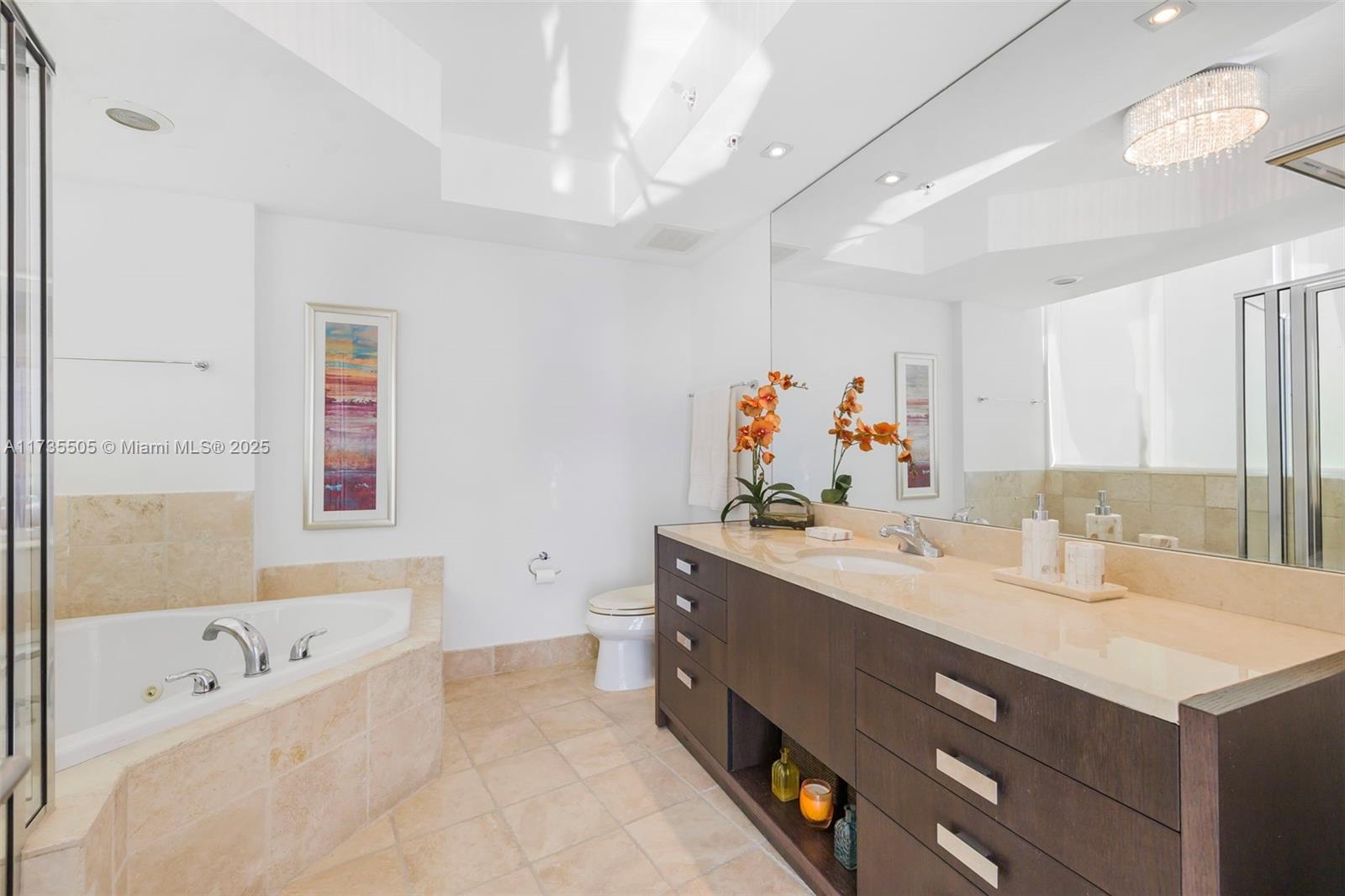 18201 Collins Avenue, Unit PH5109 Sunny Isles Beach, FL 33160 - Photo 27 of 53 a bathroom with a tub sink and mirror