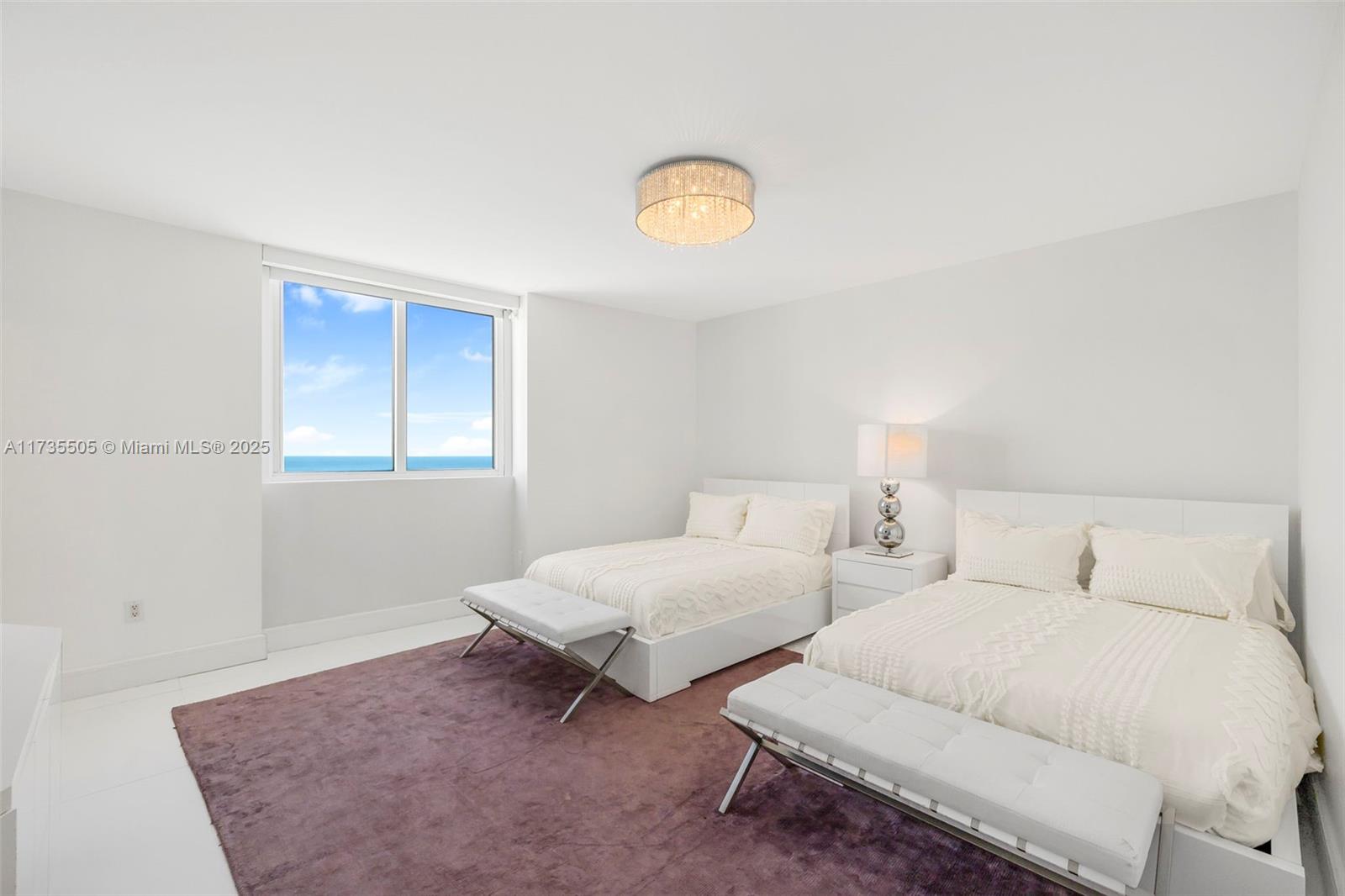 18201 Collins Avenue, Unit PH5109 Sunny Isles Beach, FL 33160 - Photo 30 of 53 a bedroom with two beds and a window