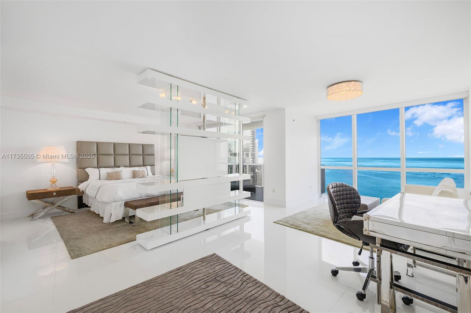 18201 Collins Avenue, Unit PH5109 Sunny Isles Beach, FL 33160 - Photo 32 of 53 a living room with furniture and a window