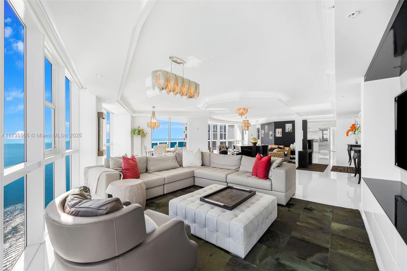 18201 Collins Avenue, Unit PH5109 Sunny Isles Beach, FL 33160 - Photo 7 of 53 a living room with furniture and a potted plant