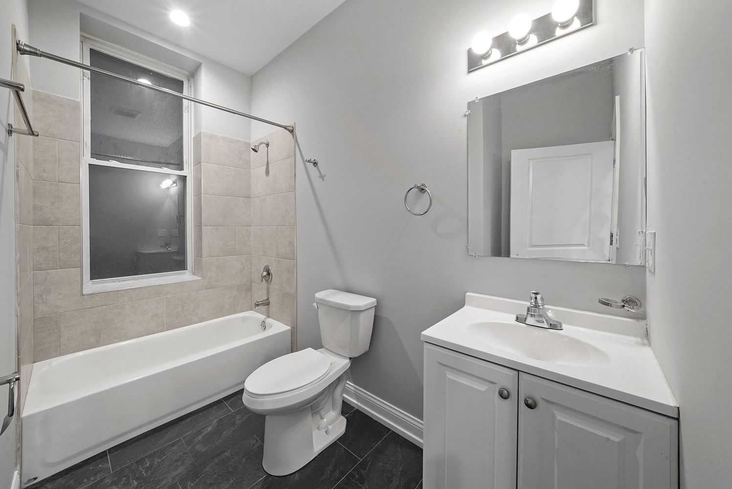 1946 South Racine Avenue, Unit 2R Chicago, IL 60608 - Photo 11 of 12 a bathroom with a sink a toilet and shower