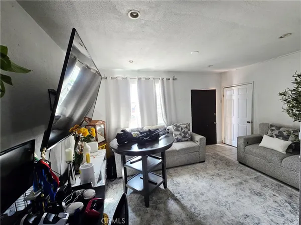 a view of a dining room with furniture and a livingroom