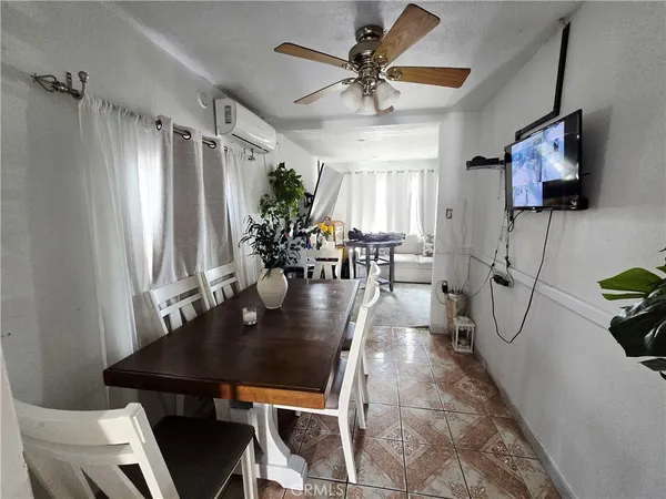 a large kitchen with stainless steel appliances a stove refrigerator a oven and a sink