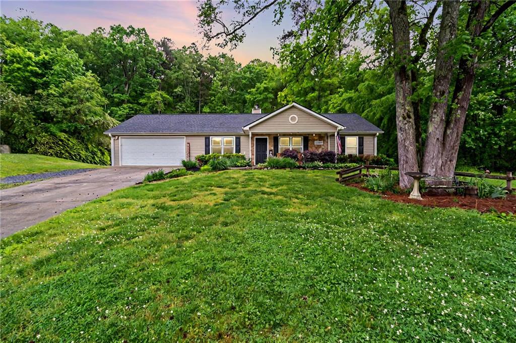 452 Vernon Road Northeast Rome, GA 30165 - Photo 1 of 1 a view of a house with yard and a garden