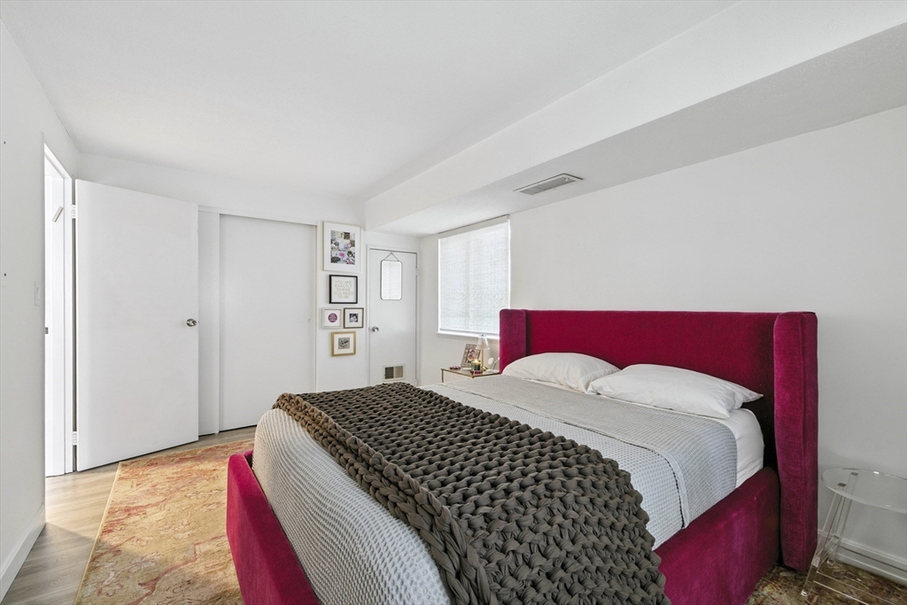 3 Post Oak Lane, Unit 1 Natick, MA 01760 - Photo 7 of 13 a bedroom with a bed and a window