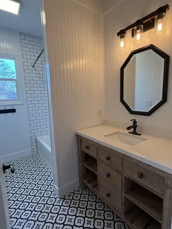 a bathroom with a bathtub and a shower
