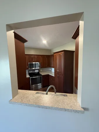 a room with table chairs and wooden floor