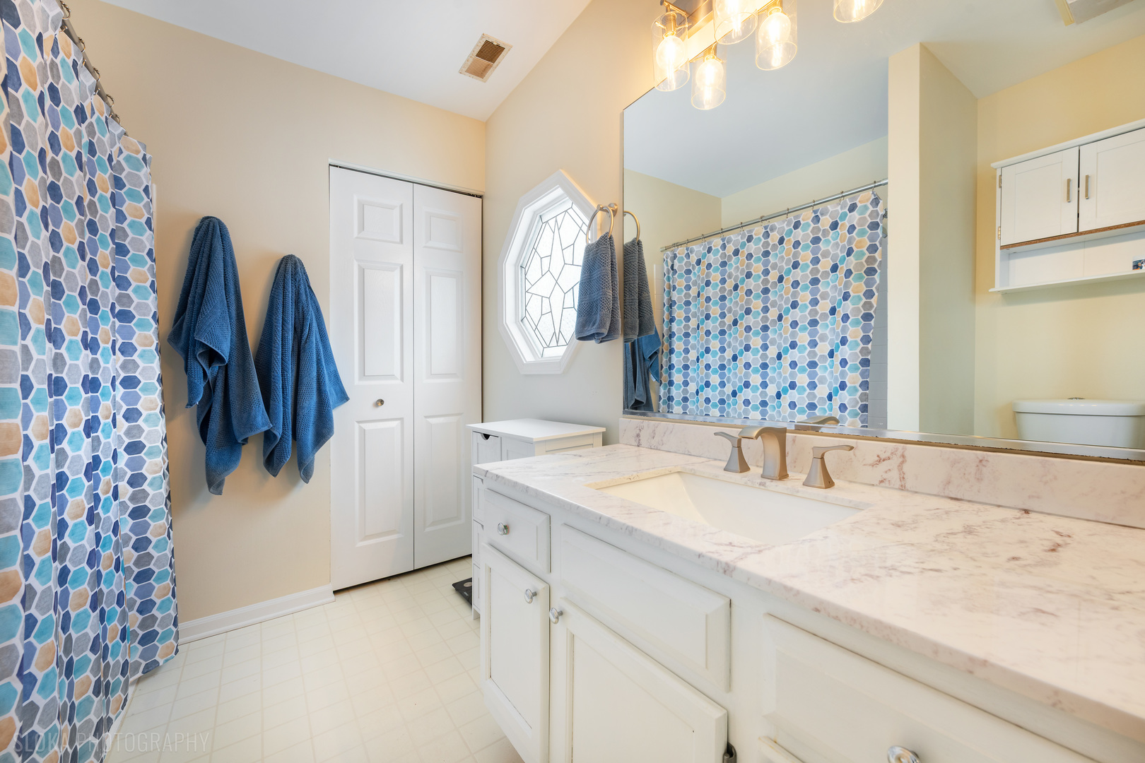 1259 Chickory Ridge Trail Cary, IL 60013 - Photo 16 of 31 a bathroom with a granite countertop sink a shower and a mirror