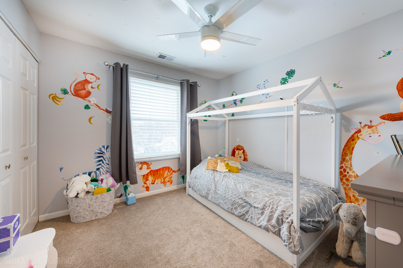 1259 Chickory Ridge Trail Cary, IL 60013 - Photo 17 of 31 a bedroom with a bed and a chandelier